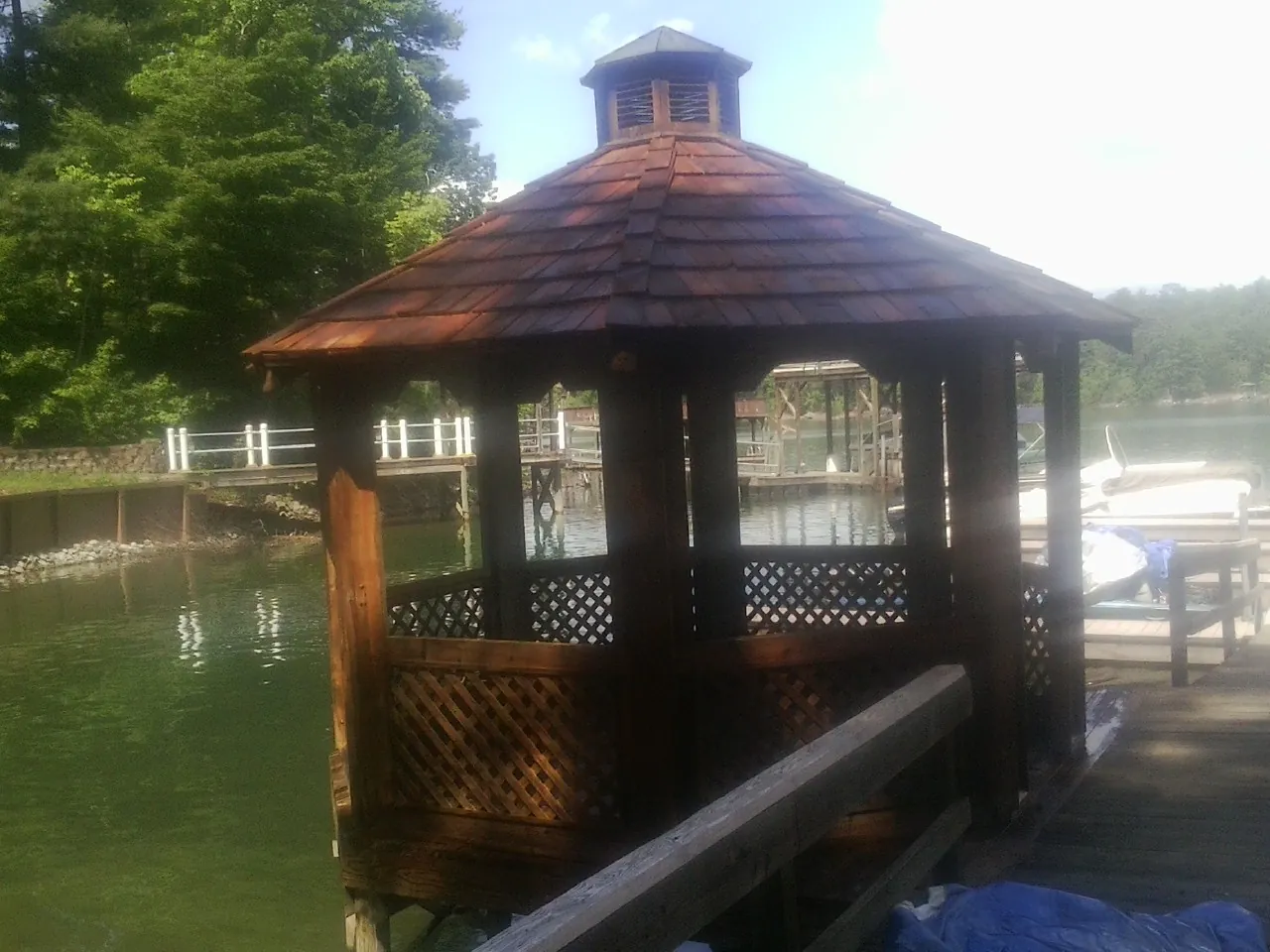 Cedar shake gazebo roof rebuilt on a lake dock in Wells River